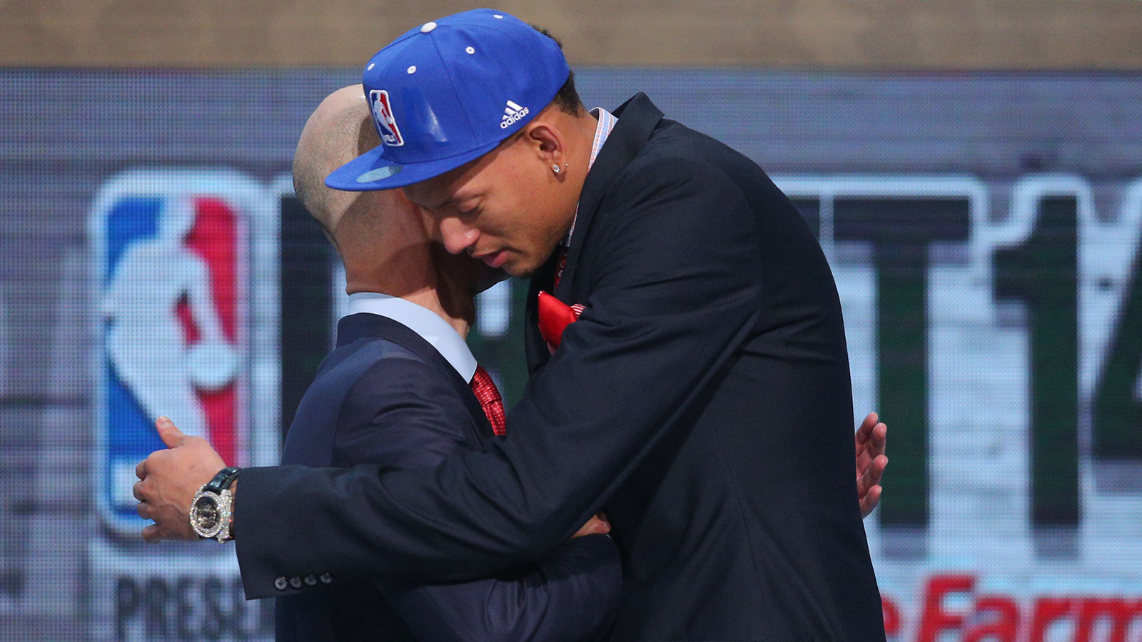 Jun 26, 2014; Brooklyn, NY, USA; Isaiah Austin (Baylor) hugs NBA commissioner Adam Silver after being selected as an honorary draft pick by the NBA during the 2014 NBA Draft at the Barclays Center. Austin was diagnosed with Marfan Syndrome ending his career. Mandatory Credit: Brad Penner-USA TODAY Sports