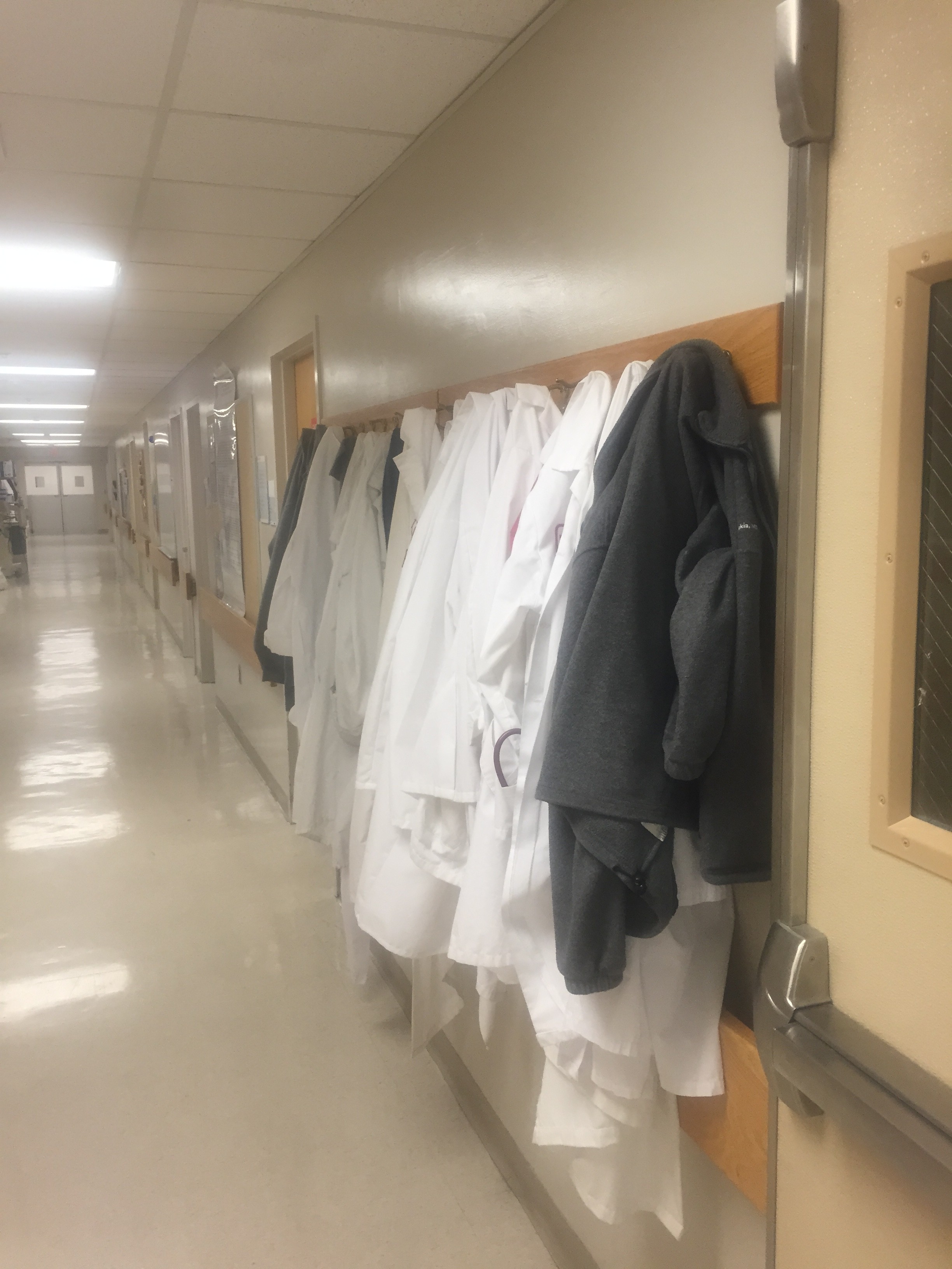 Lab coat rack outside the operating room